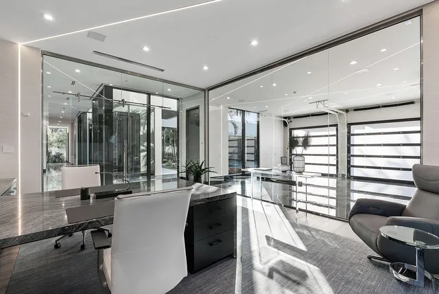 a bed room with bed and a large window