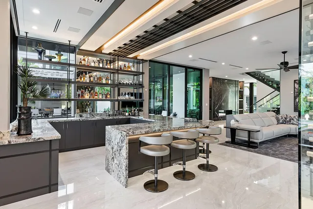 a house with swimming pool in front of it