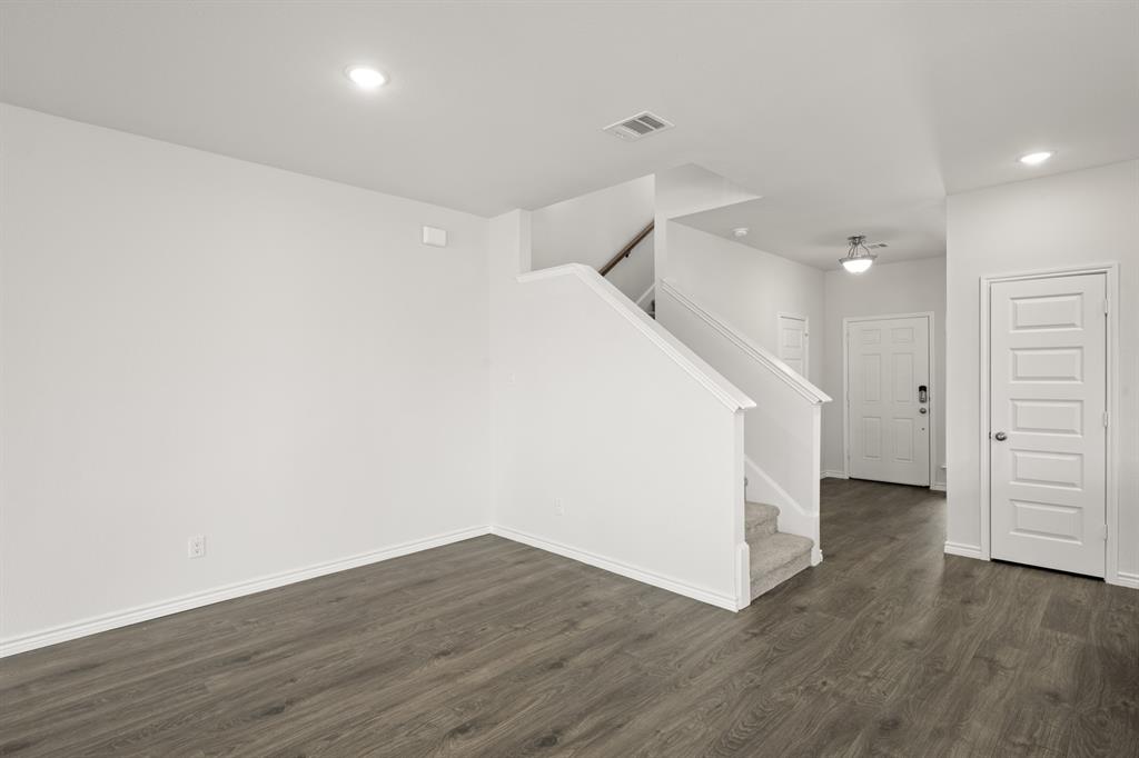 409-411 Saddle Drive Denton, TX 76209 - Photo 13 of 29 wooden floor in an empty room with wooden floor