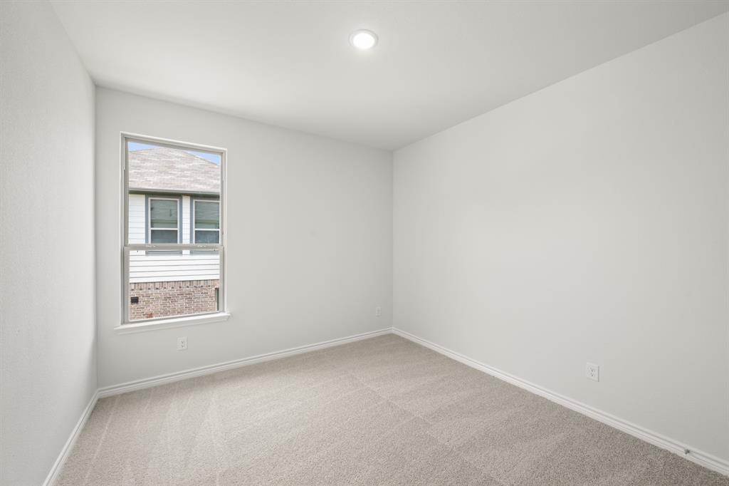 409-411 Saddle Drive Denton, TX 76209 - Photo 24 of 29 an empty room with a window