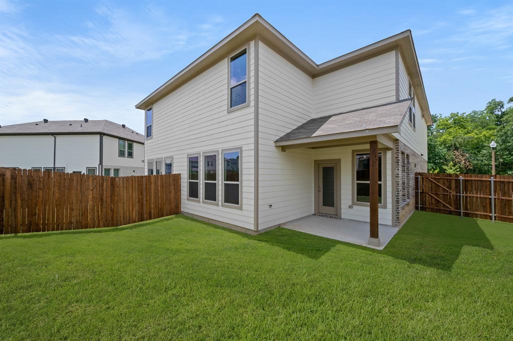 409-411 Saddle Drive Denton, TX 76209 - Photo 28 of 29 a view of a house with backyard
