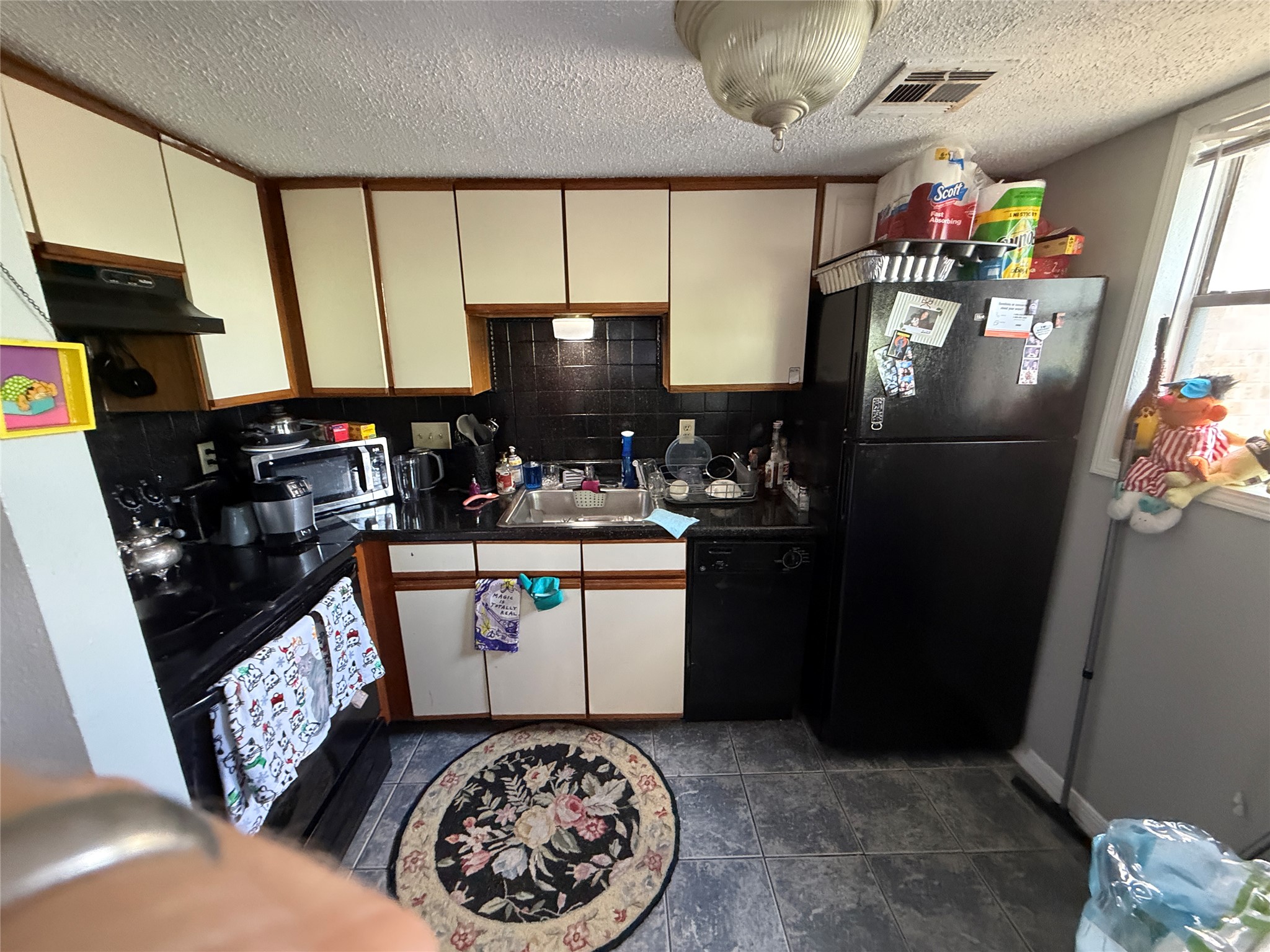 2500 Burleson Road, Unit 611 Austin, TX 78741 - Photo 16 of 22 a kitchen with refrigerator and window