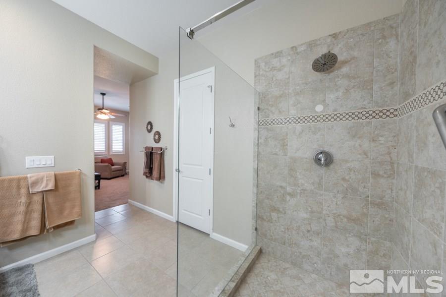 2285 Trakehner Lane, Unit NV Reno, NV 89521 - Photo 14 of 23 a bathroom with a shower and a sink