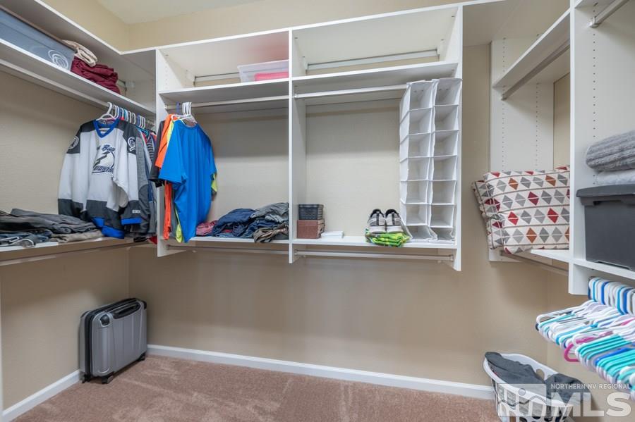2285 Trakehner Lane, Unit NV Reno, NV 89521 - Photo 15 of 23 a view of walk in closet with clothes and shoes