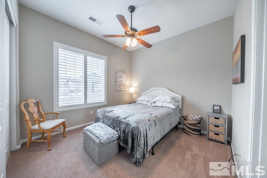 2285 Trakehner Lane, Unit NV Reno, NV 89521 - Photo 16 of 23 a bedroom with a bed and a window