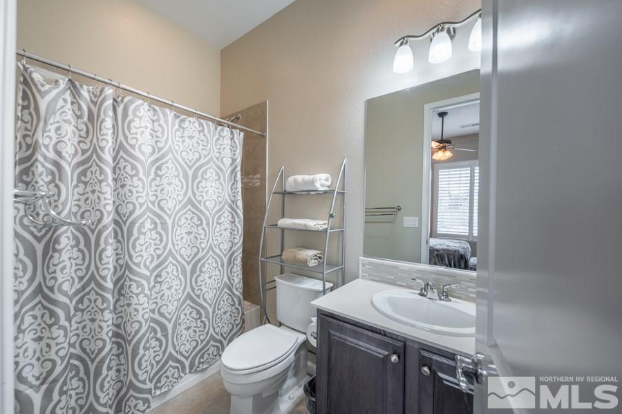 2285 Trakehner Lane, Unit NV Reno, NV 89521 - Photo 17 of 23 a bathroom with a sink toilet and shower