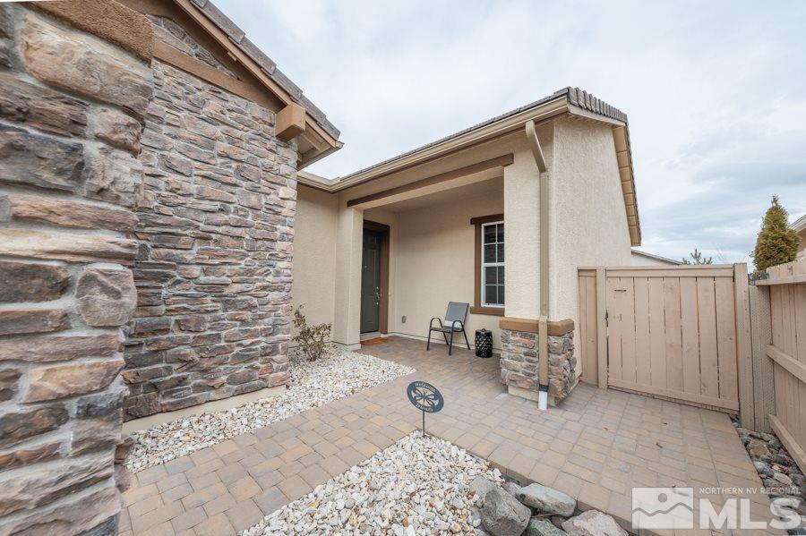 2285 Trakehner Lane, Unit NV Reno, NV 89521 - Photo 2 of 23 a view of house with backyard and outdoor seating