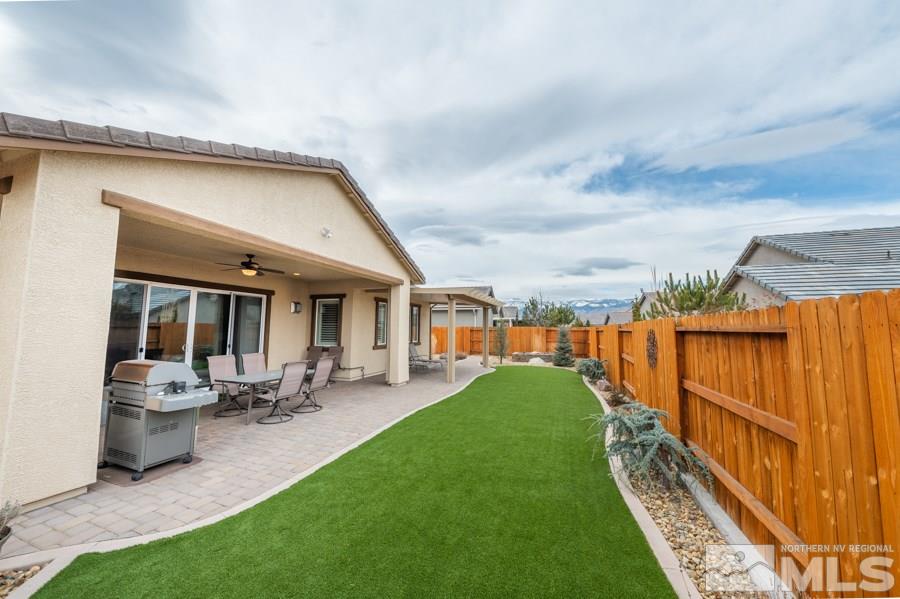 2285 Trakehner Lane, Unit NV Reno, NV 89521 - Photo 23 of 23 a swimming pool with outdoor seating and yard