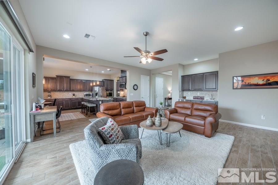 2285 Trakehner Lane, Unit NV Reno, NV 89521 - Photo 5 of 23 a living room with furniture kitchen view and a chandelier