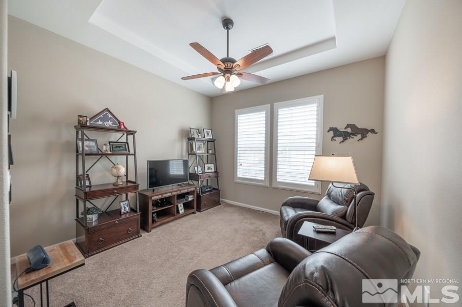 2285 Trakehner Lane, Unit NV Reno, NV 89521 - Photo 10 of 23 a living room with furniture a ceiling fan and a window