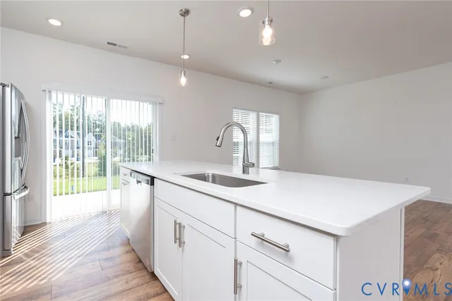 a kitchen with a sink and large window