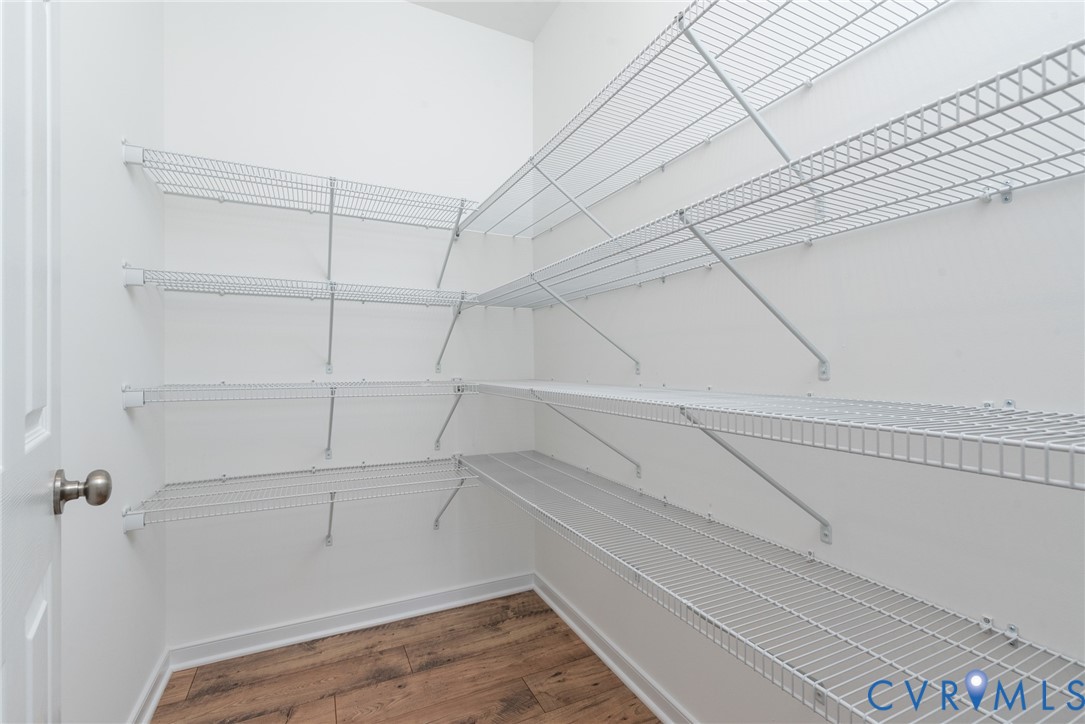 11301 Benton Pointe Way Chester, VA 23831 - Photo 14 of 29 a view of a room with racks on the wall