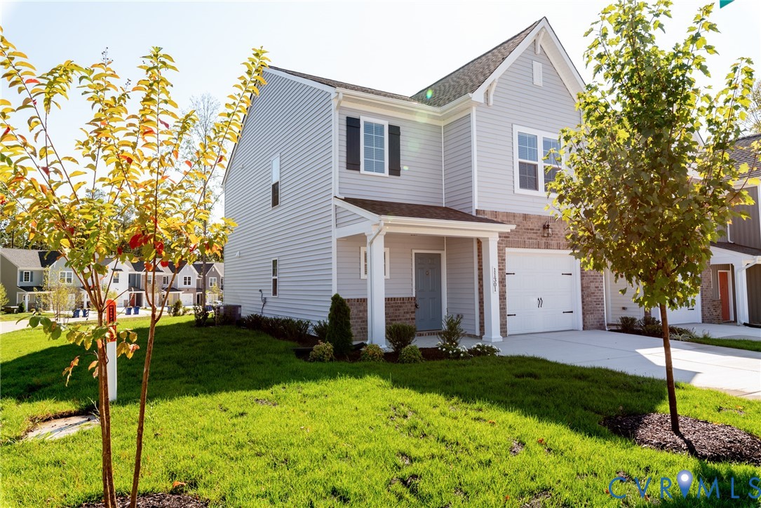 11301 Benton Pointe Way Chester, VA 23831 - Photo 2 of 29 a front view of house with yard and green space
