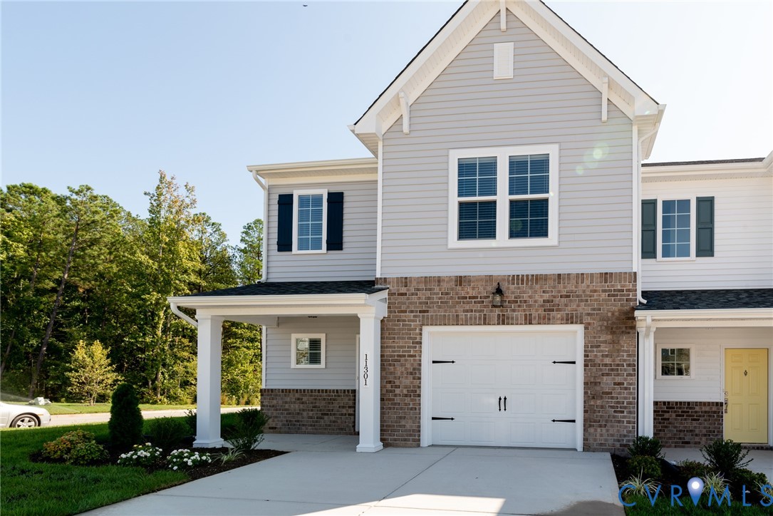 11301 Benton Pointe Way Chester, VA 23831 - Photo 5 of 29 a front view of a house with a garage