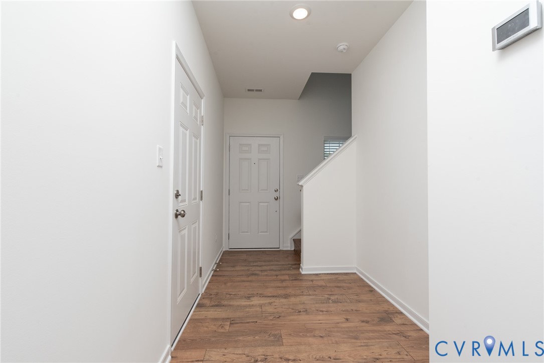 11301 Benton Pointe Way Chester, VA 23831 - Photo 9 of 29 a view of a hallway with wooden floor