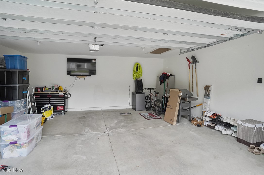 603 South Raccoon Road, Unit 13 Youngstown, OH 44515 - Photo 22 of 27 Garage featuring a garage door opener