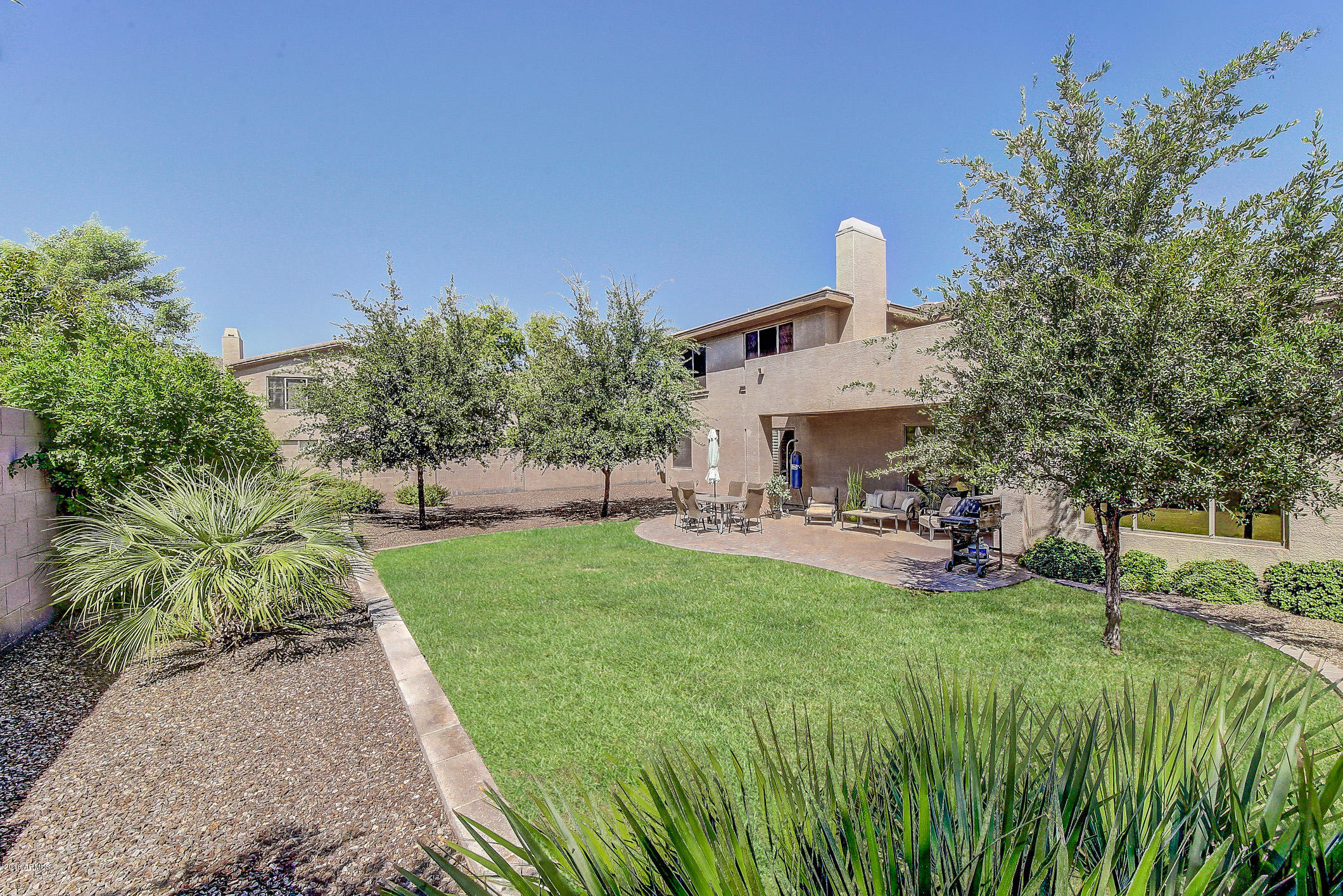 4673 East Ruffian Road Gilbert, AZ 85297 - Photo 45 of 58 a view of a backyard with sitting area
