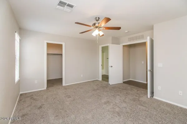 a bathroom with a sink tub vanity and a mirror