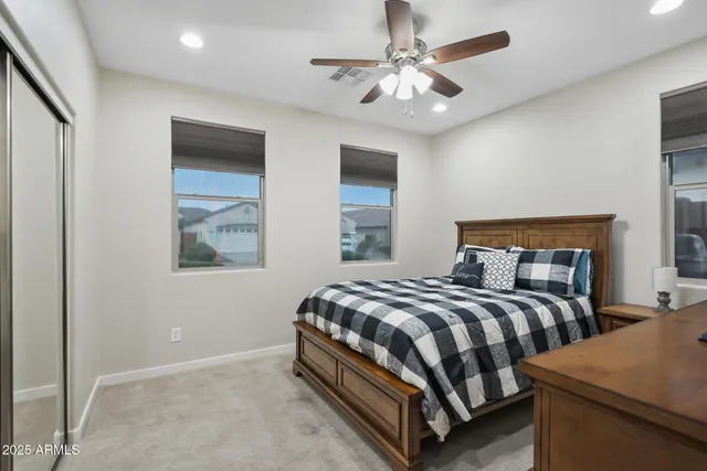 a view of an empty room and a kitchen