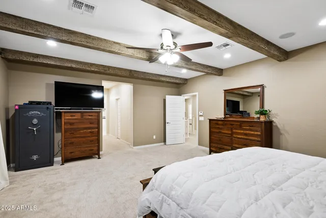 a spacious bathroom with a granite countertop sink a mirror a bathtub and a shower