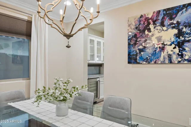 a large kitchen with granite countertop a large counter top stainless steel appliances and cabinets