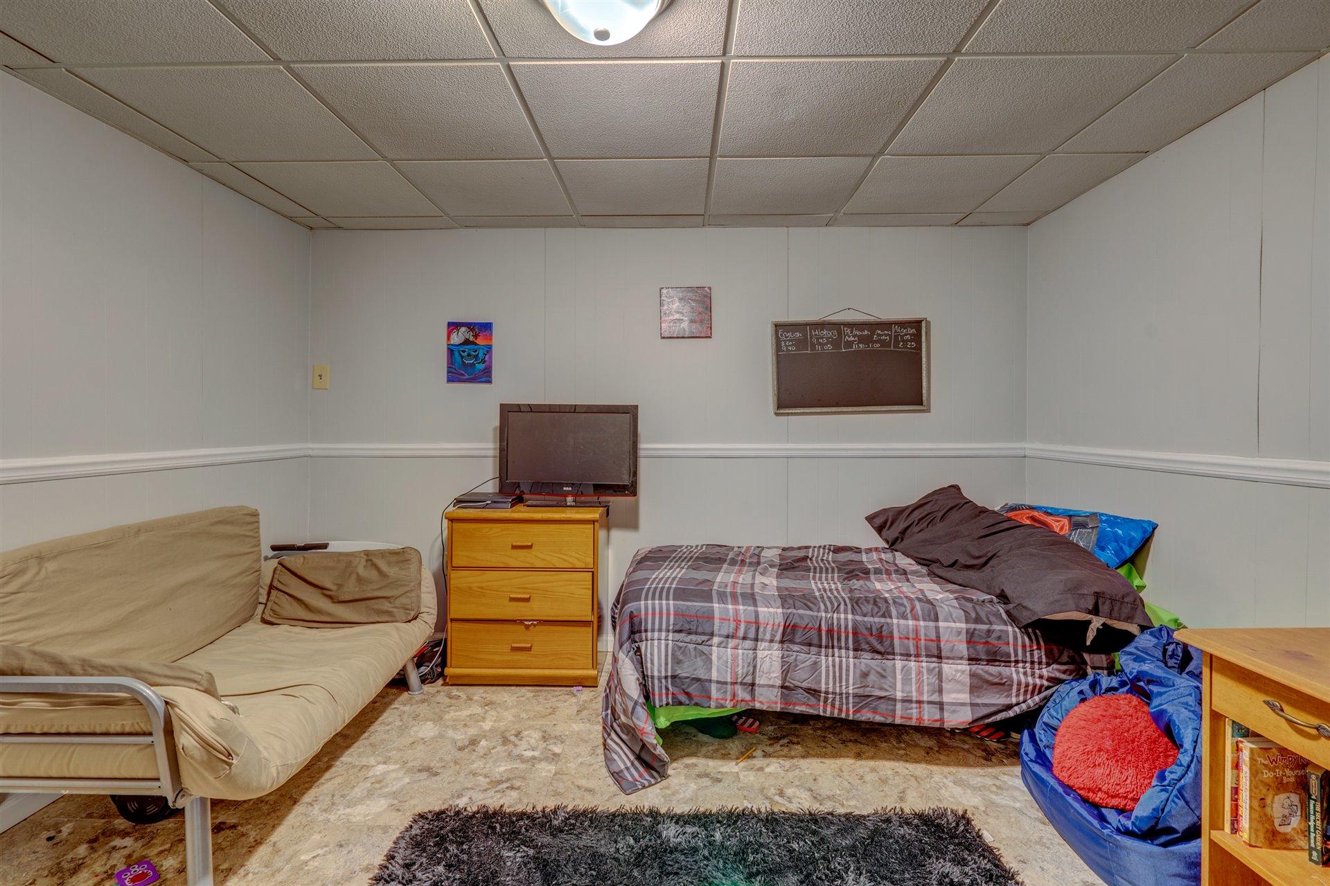 1716 Mountain View Road Vinton, VA 24179 - Photo 19 of 28 a bedroom with a bed and dresser