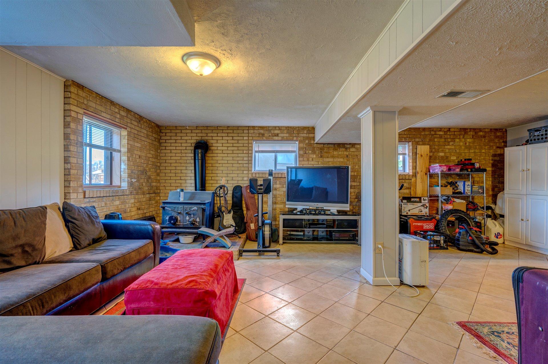 1716 Mountain View Road Vinton, VA 24179 - Photo 22 of 28 a living room with furniture and a flat screen tv