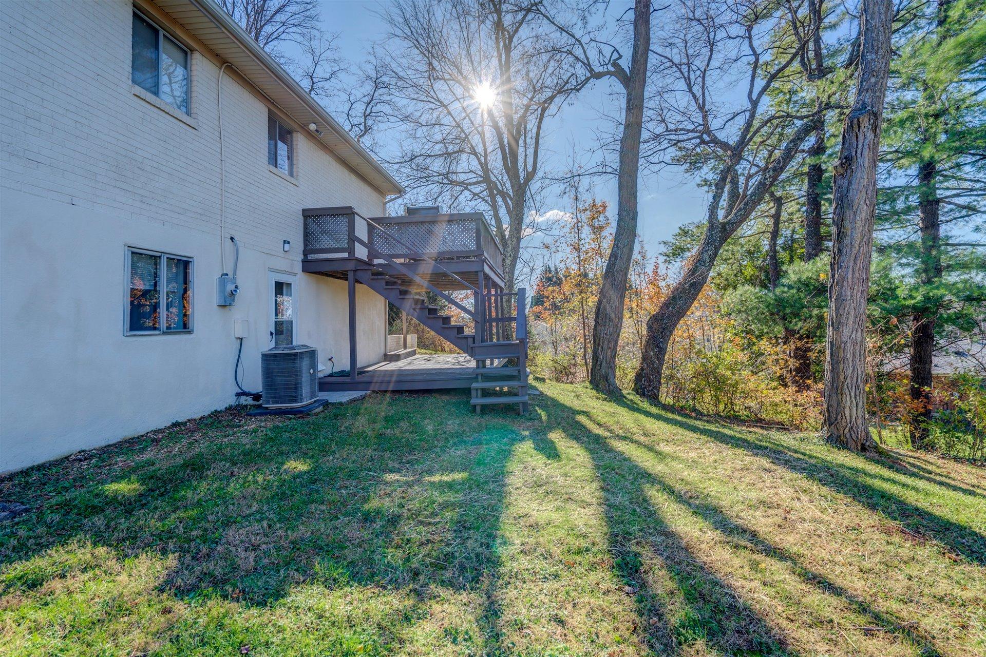 1716 Mountain View Road Vinton, VA 24179 - Photo 24 of 28 a view of backyard with wooden fence and a large tree