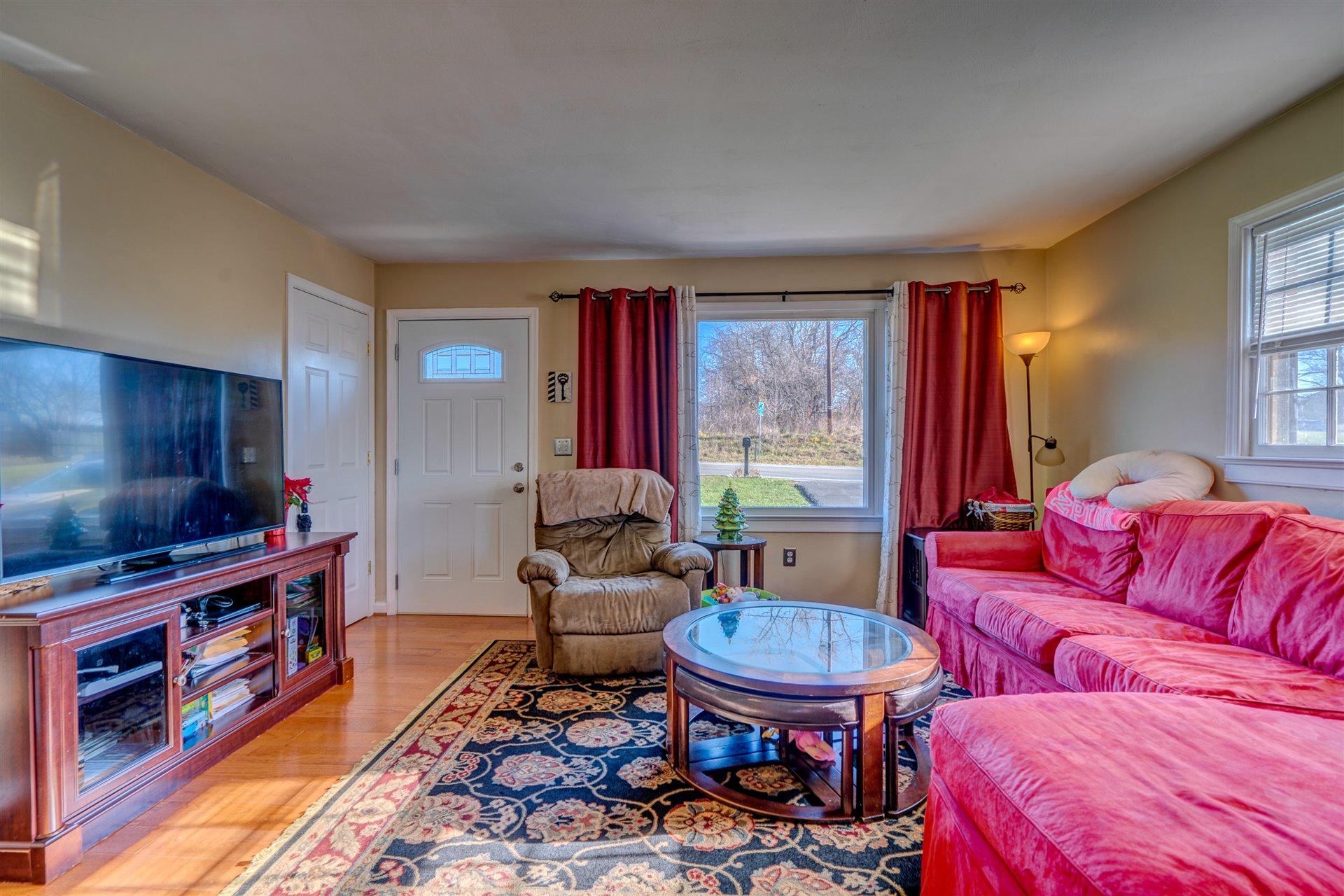 1716 Mountain View Road Vinton, VA 24179 - Photo 6 of 28 a living room with furniture and a flat screen tv