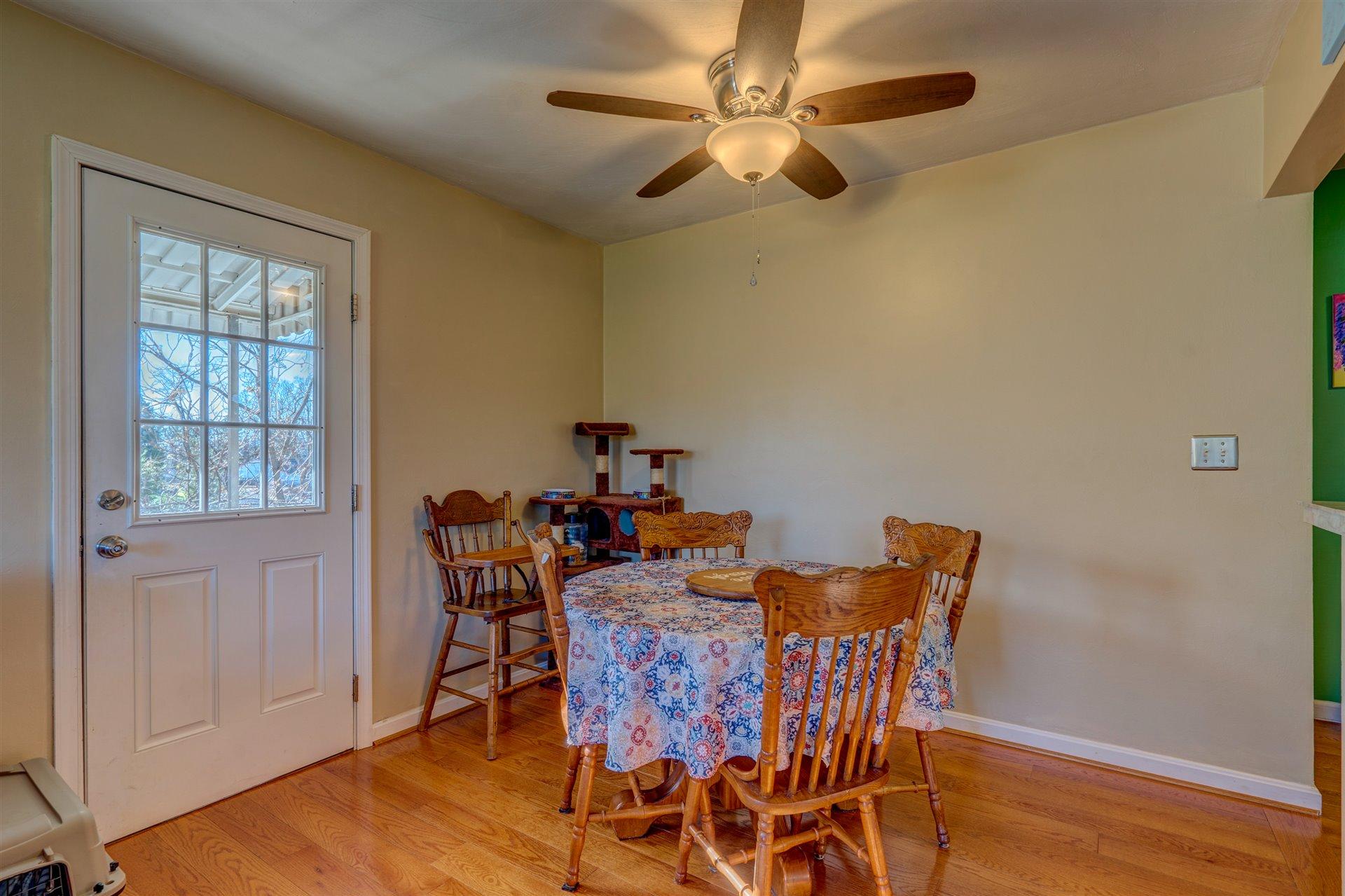 1716 Mountain View Road Vinton, VA 24179 - Photo 9 of 28 a view of a dining room with furniture and wooden floor