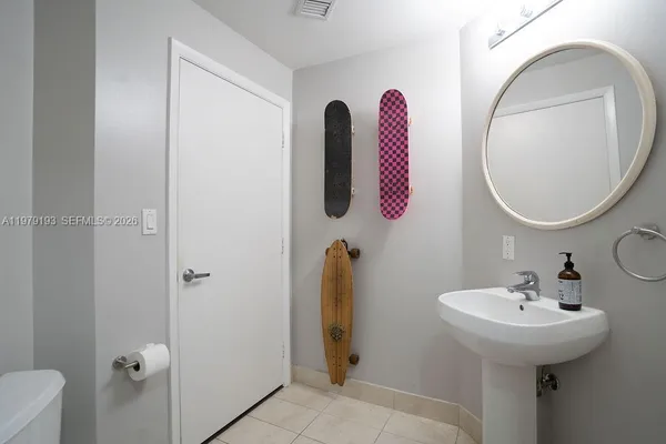 a bathroom with a sink and mirror