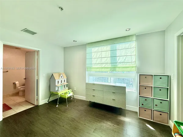 a view of a bedroom with a window