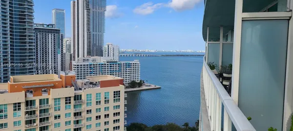 a balcony with a potted plant