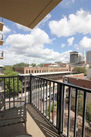 a view of a balcony with city view