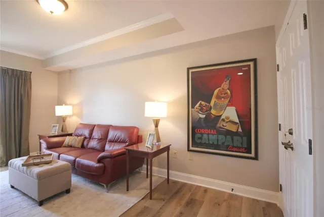 a living room with furniture and a painting