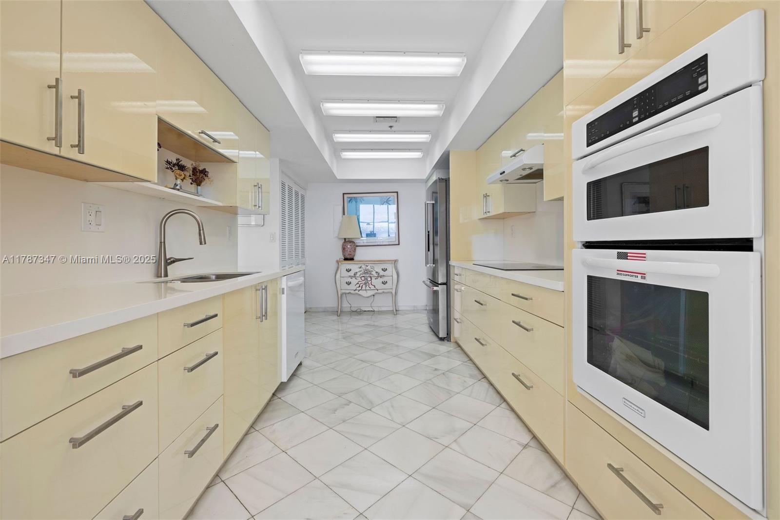 520 Brickell Key Drive, Unit A201 Miami, FL 33131 - Photo 11 of 52 a kitchen with stainless steel appliances granite countertop a stove and a sink