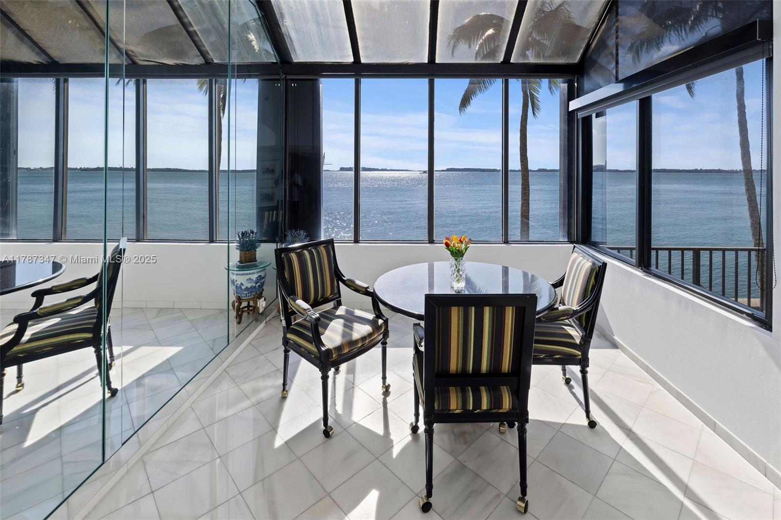 520 Brickell Key Drive, Unit A201 Miami, FL 33131 - Photo 13 of 52 a view of a dining room with furniture and window