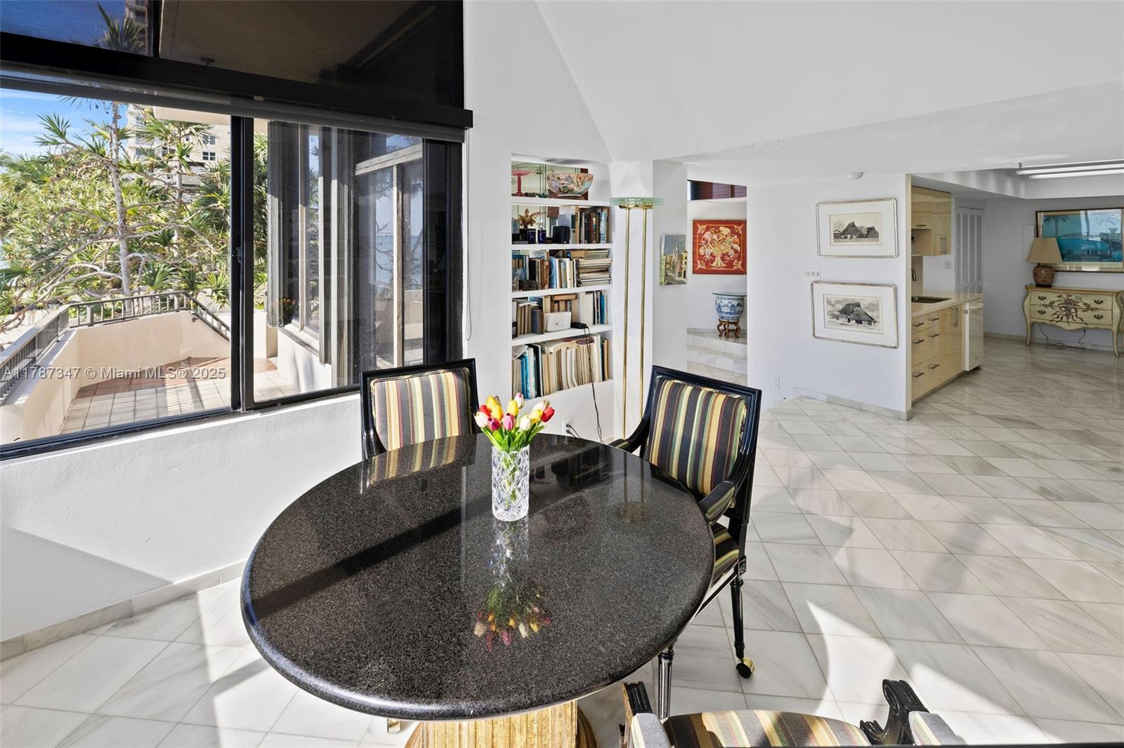 520 Brickell Key Drive, Unit A201 Miami, FL 33131 - Photo 18 of 52 a dining room with furniture and window