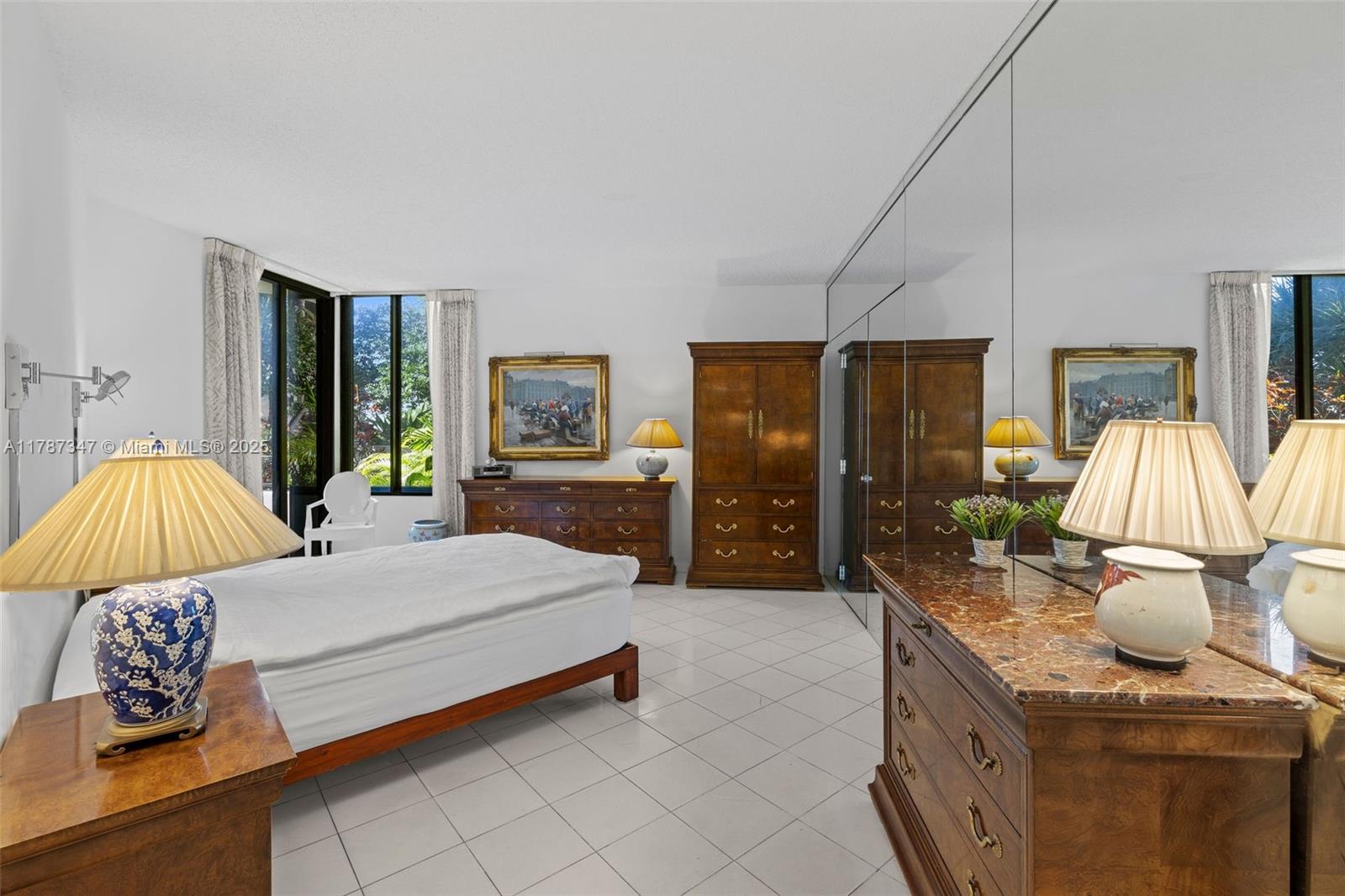 520 Brickell Key Drive, Unit A201 Miami, FL 33131 - Photo 20 of 52 a bedroom with a bed and window