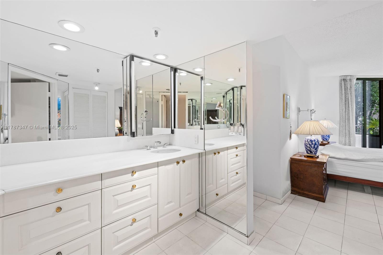 520 Brickell Key Drive, Unit A201 Miami, FL 33131 - Photo 22 of 52 a spacious bathroom with a granite countertop sink mirror and bathtub