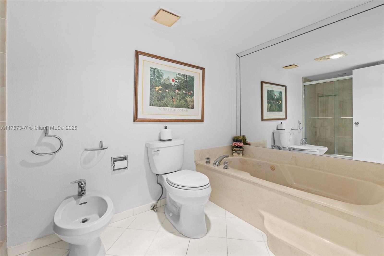 520 Brickell Key Drive, Unit A201 Miami, FL 33131 - Photo 25 of 52 a bathroom with a toilet sink and mirror