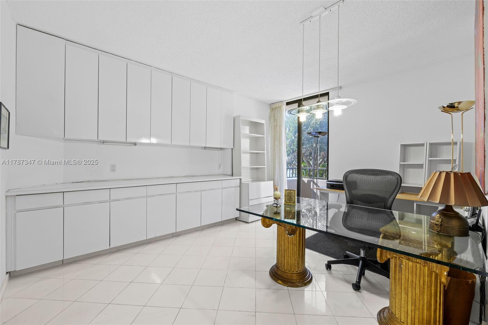 520 Brickell Key Drive, Unit A201 Miami, FL 33131 - Photo 27 of 52 a kitchen with a sink cabinets and appliances