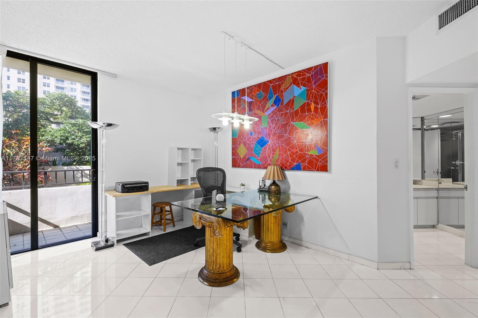 520 Brickell Key Drive, Unit A201 Miami, FL 33131 - Photo 28 of 52 a living room with furniture a floor to ceiling window and kitchen view