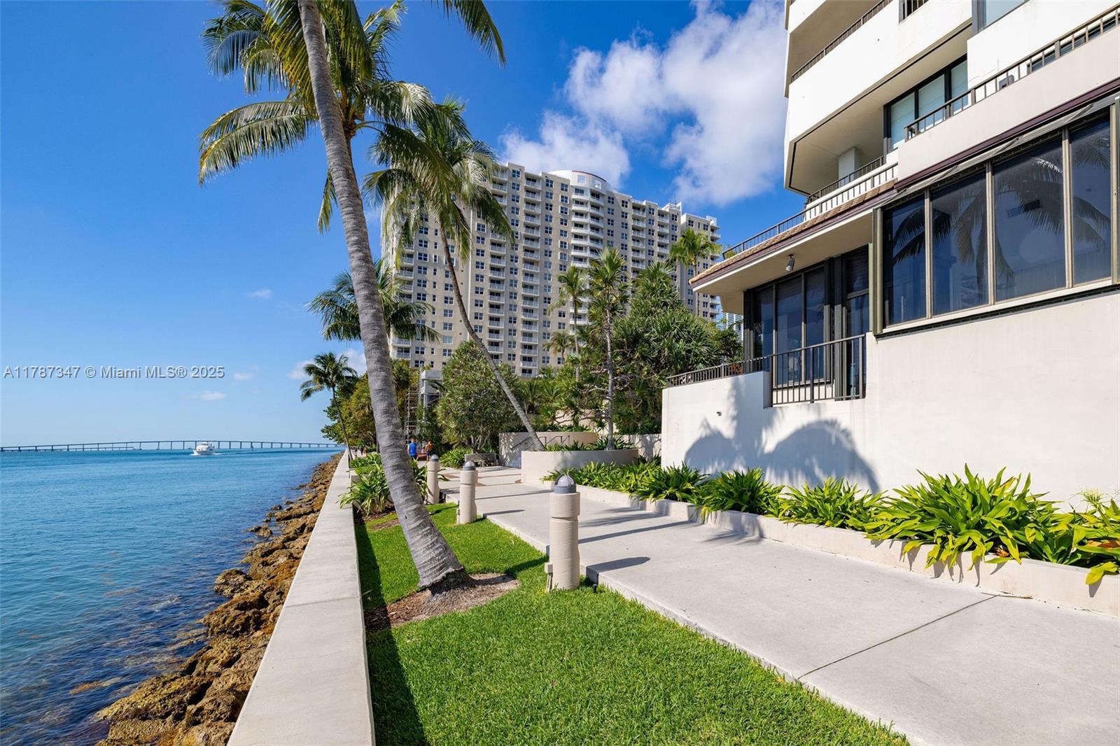 520 Brickell Key Drive, Unit A201 Miami, FL 33131 - Photo 43 of 52 a front view of a house with a yard