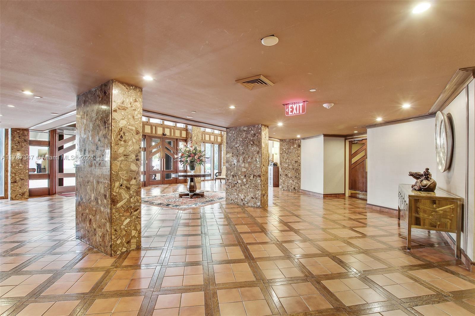 520 Brickell Key Drive, Unit A201 Miami, FL 33131 - Photo 50 of 52 a lobby with furniture and a rug