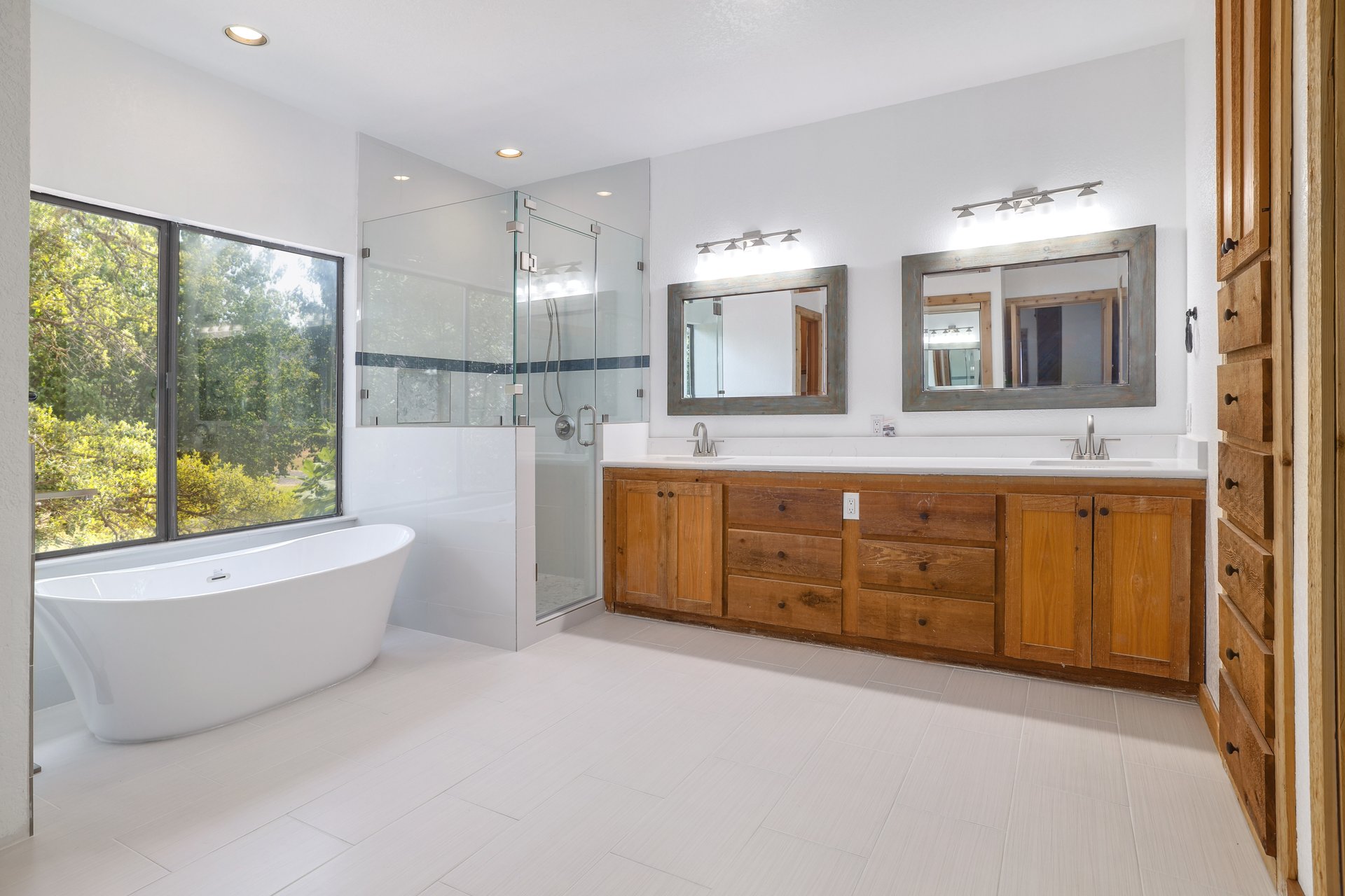 313 Kendall Road Spicewood, TX 78669 - Photo 13 of 34 Full bath with a shower stall, a soaking tub, double vanity, and recessed lighting