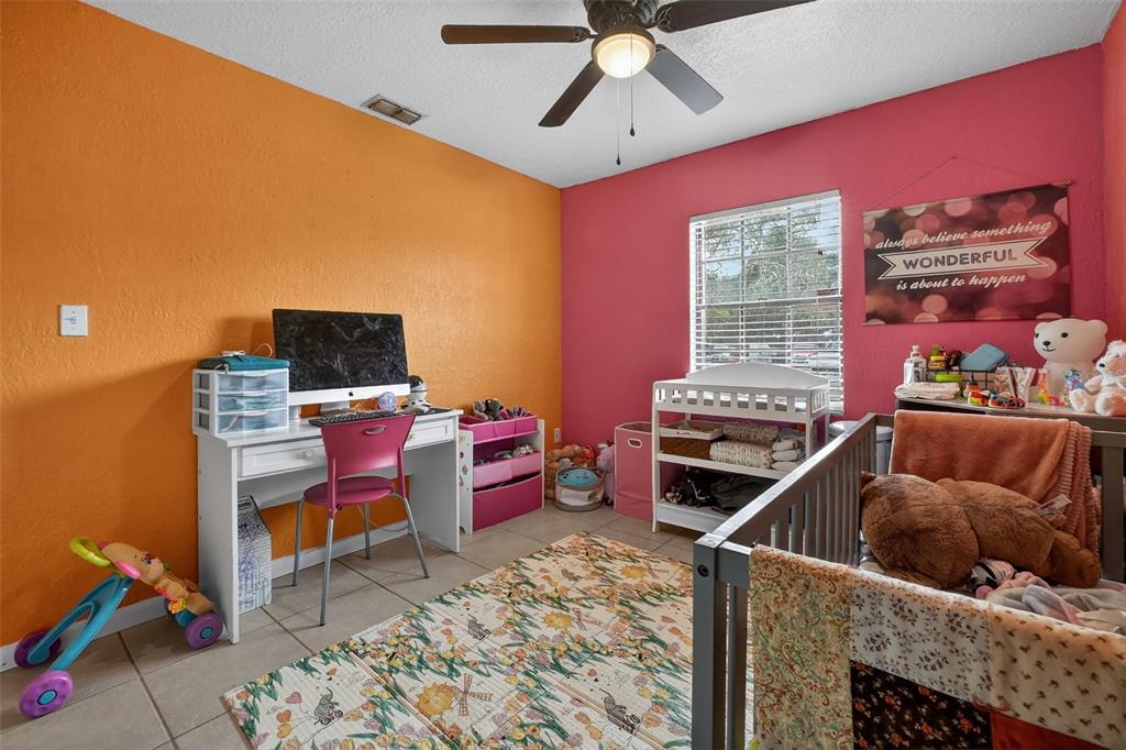 1644 Ruth Street Cocoa, FL 32926 - Photo 18 of 38 a living room with furniture and a flat screen tv