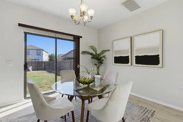 a view of a dining room with furniture window and outside view