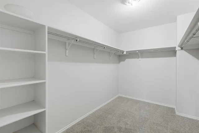 a view of an empty walk in closet