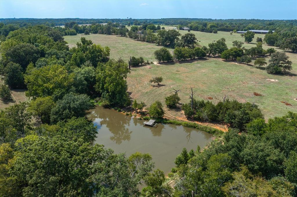 20 Interstate 20 Lindale, TX 75706 - Photo 15 of 22 an aerial view of lake residential house with outdoor space and trees around